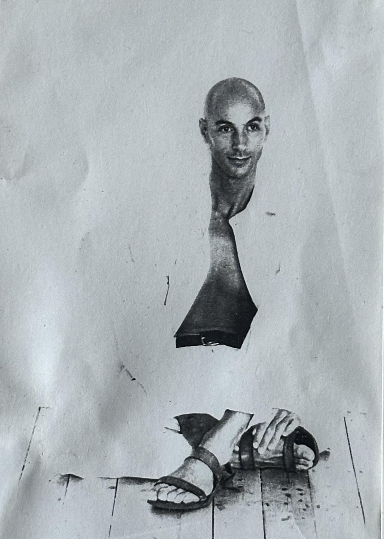Torn-paper collage self-portrait, the face split across two halves